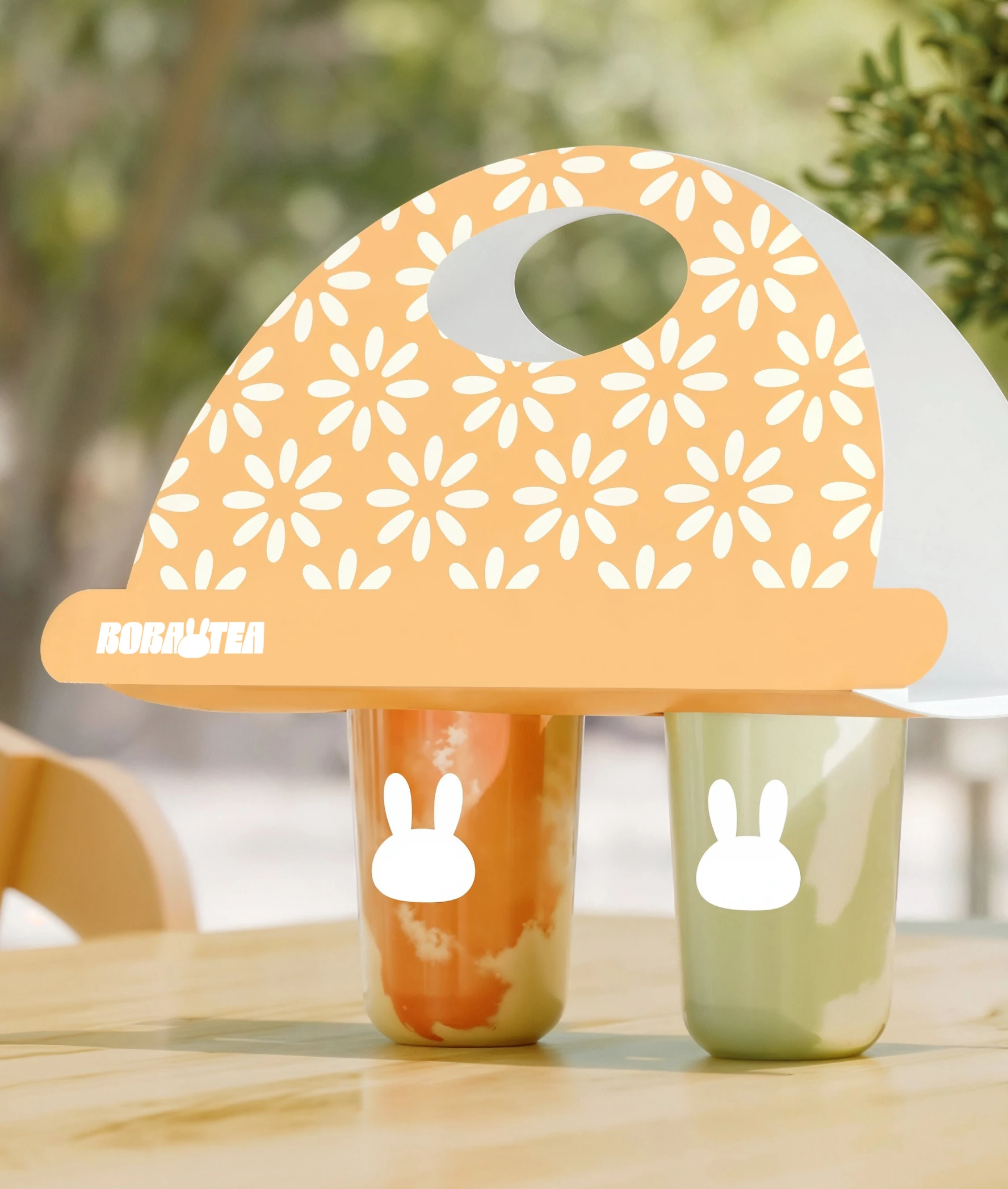 Boba tea image 9 — close-up of hand reaching for a frosted bubble tea cup with the white bunny-cup logomark
