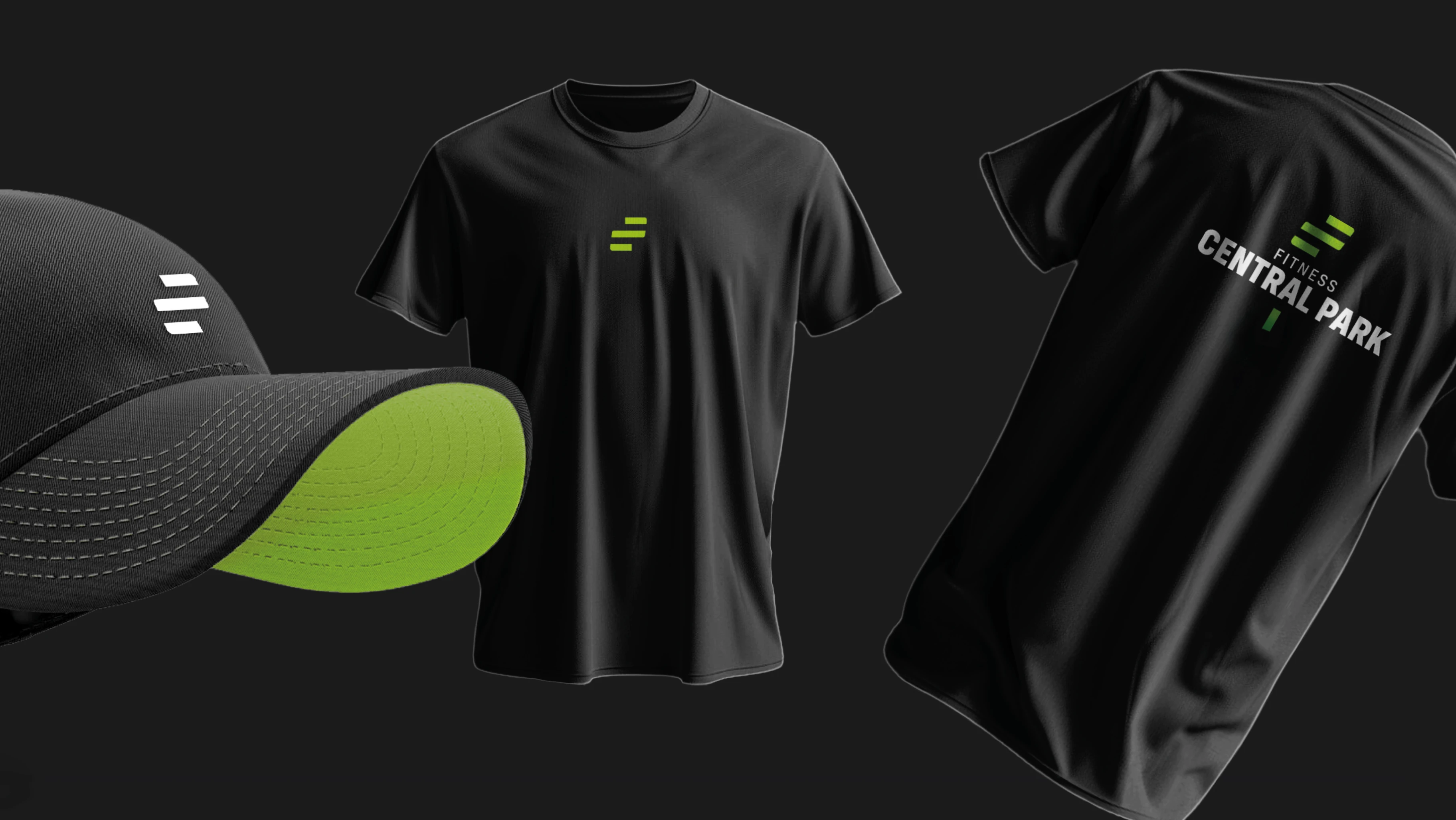 Fitness Central Park merch lineup — black baseball cap with green underbrim, black training T-shirt front with green F-mark, and back T-shirt with stacked Fitness Central Park wordmark on a dark studio backdrop